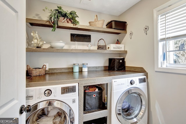 laundry area with washer and dryer