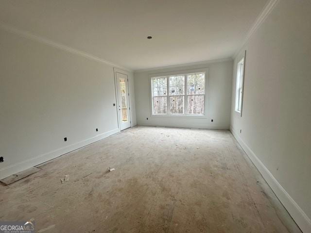 unfurnished room with crown molding