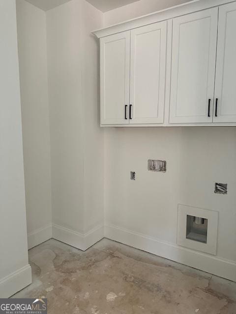 clothes washing area featuring cabinets and washer hookup