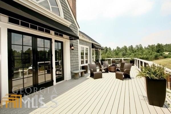 wooden deck featuring french doors