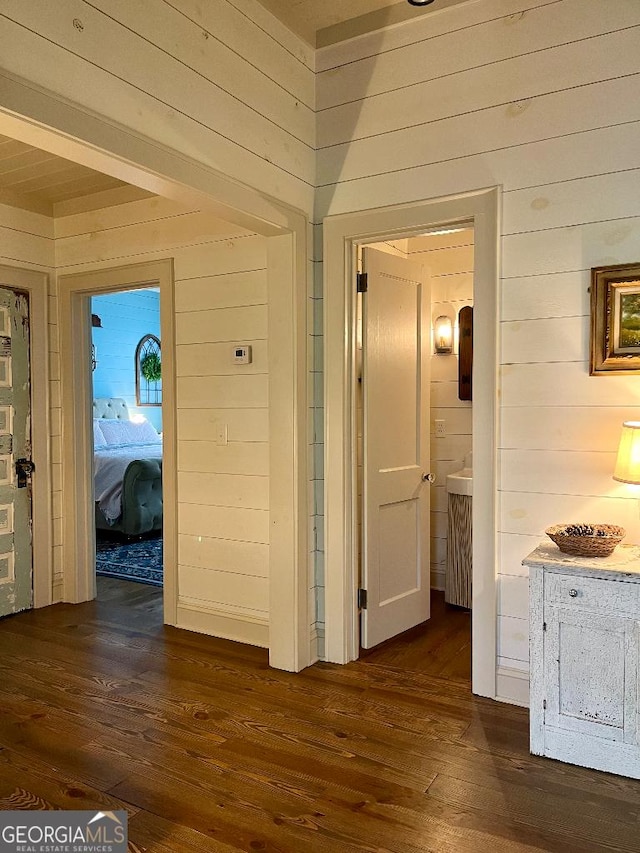 182 Rogers St, Hazlehurst, GA 31539 - hall featuring wooden walls and dark wood-type flooring