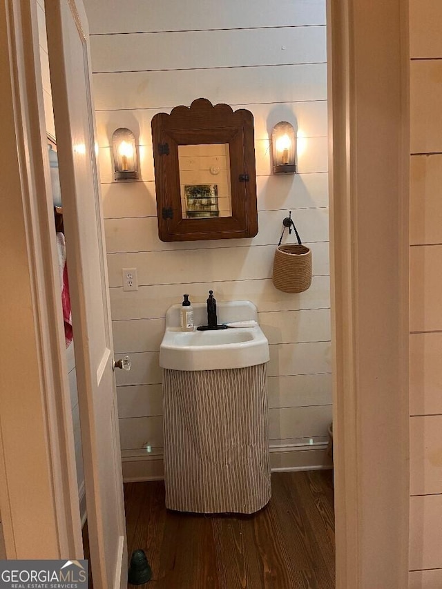 182 Rogers St, Hazlehurst, GA 31539 - half bath with wood finished floors and a sink