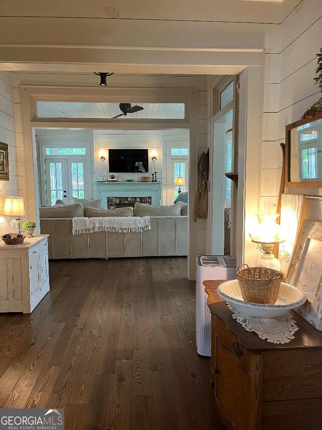 182 Rogers St, Hazlehurst, GA 31539 - hall with dark wood-style floors and wooden walls