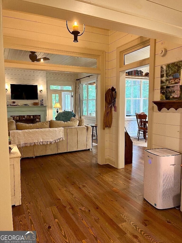 182 Rogers St, Hazlehurst, GA 31539 - living room featuring dark wood finished floors and wood walls
