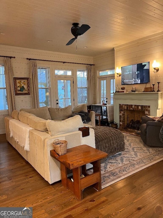 182 Rogers St, Hazlehurst, GA 31539 - living area featuring wood finished floors, ceiling fan, a fireplace, and french doors