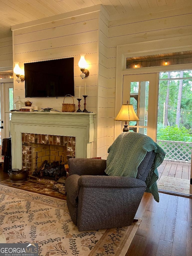 182 Rogers St, Hazlehurst, GA 31539 - living room with wood-type flooring, wooden walls, and wooden ceiling