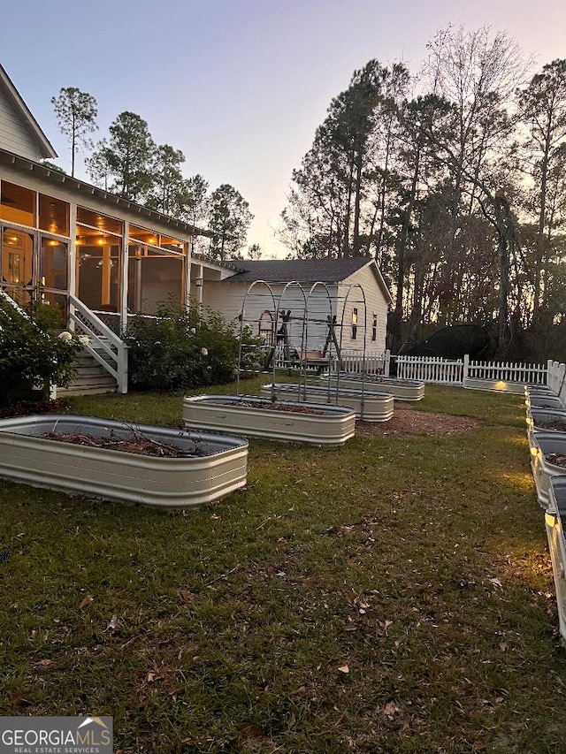 view of yard at dusk