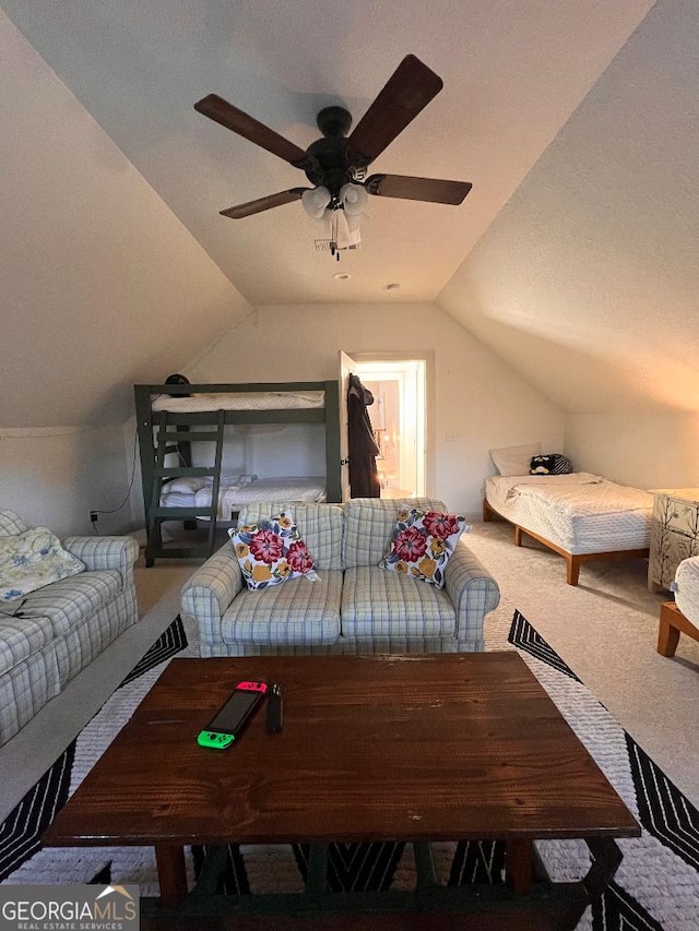 carpeted bedroom featuring lofted ceiling and ceiling fan