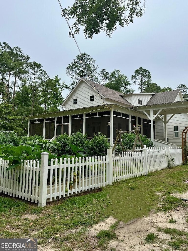 182 Rogers St, Hazlehurst, GA 31539 - back of house featuring a sunroom