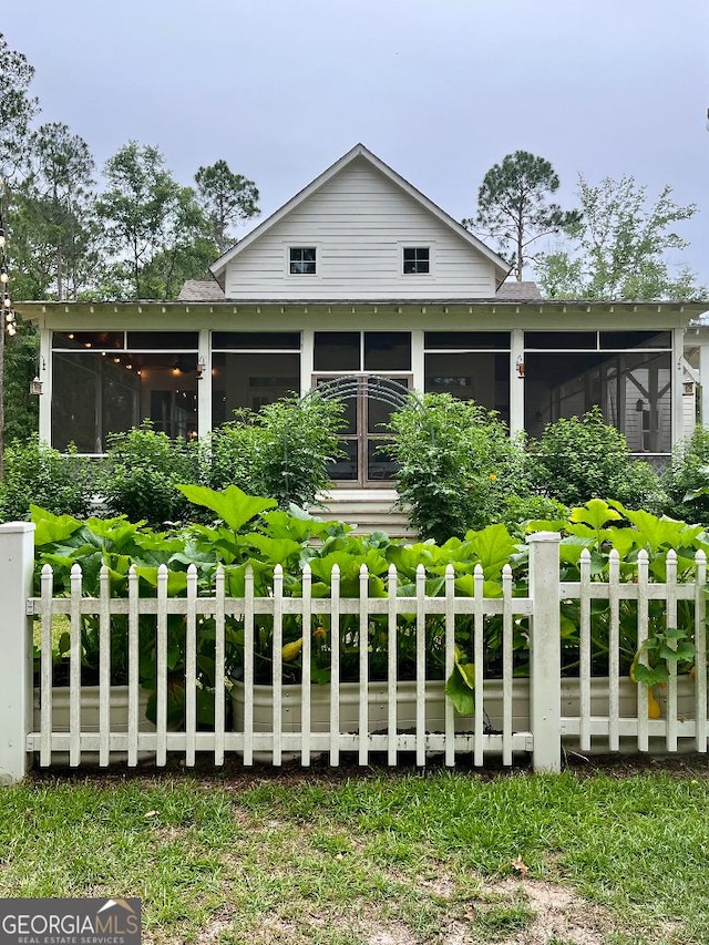 182 Rogers St, Hazlehurst, GA 31539 - rear view of property featuring a sunroom