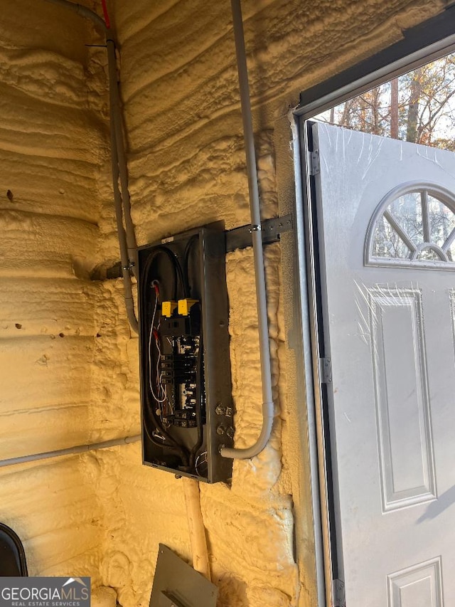 182 Rogers St, Hazlehurst, GA 31539 - detailed view of rustic walls and electric panel