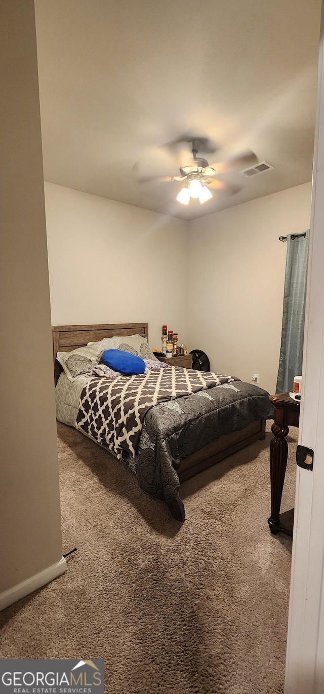 carpeted bedroom featuring ceiling fan