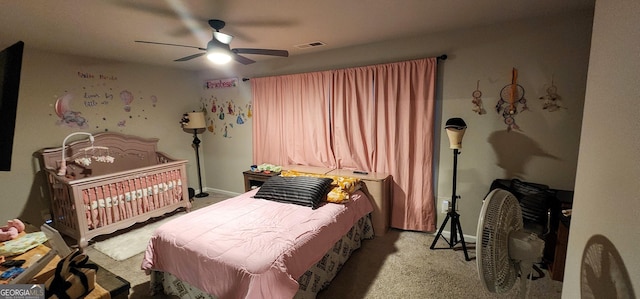 bedroom with ceiling fan and light colored carpet