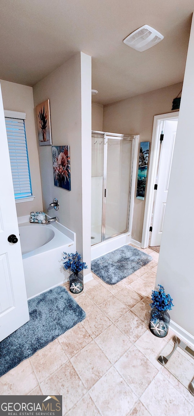 bathroom featuring plus walk in shower