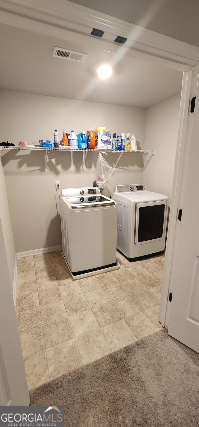 laundry area with independent washer and dryer