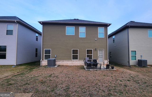 back of house with a patio and central air condition unit