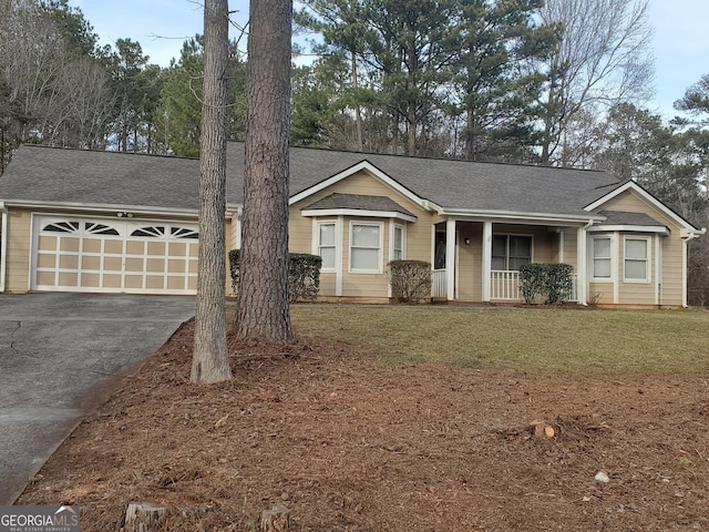 ranch-style house with a garage, covered porch, and a front lawn