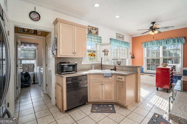 kitchen featuring light tile patterned flooring, ornamental molding, light brown cabinetry, and black dishwasher