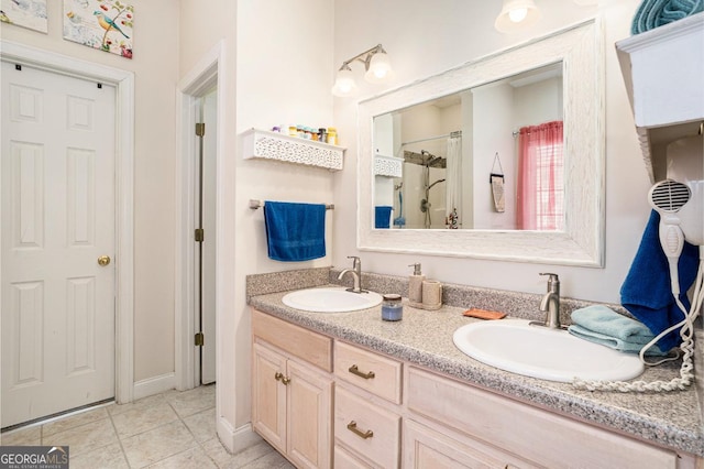 bathroom with vanity, tile patterned floors, and walk in shower