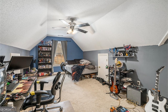 office space with ceiling fan, vaulted ceiling, carpet, and a textured ceiling