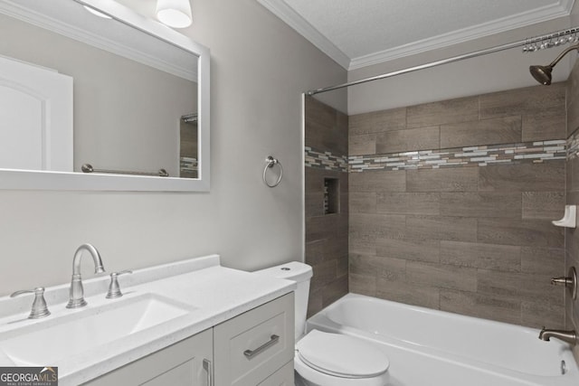 full bathroom with vanity, tiled shower / bath combo, ornamental molding, and toilet