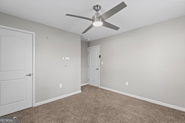 unfurnished bedroom with ceiling fan and carpet