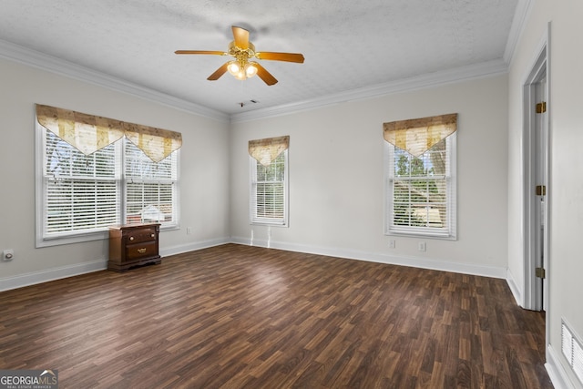 spare room with baseboards, crown molding, a ceiling fan, and wood finished floors