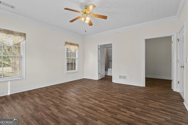 unfurnished bedroom with visible vents, dark wood-type flooring, and ornamental molding