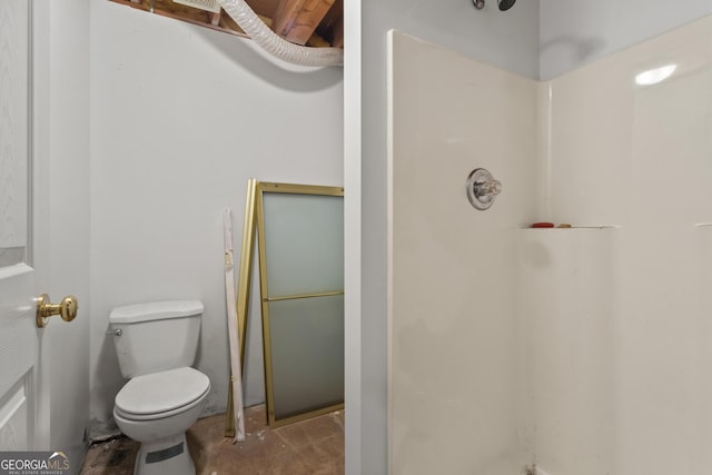 bathroom with toilet, concrete flooring, and walk in shower