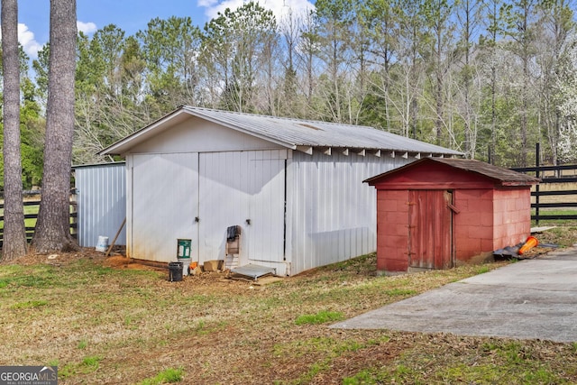 view of shed with fence