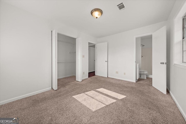 unfurnished bedroom featuring a closet and carpet