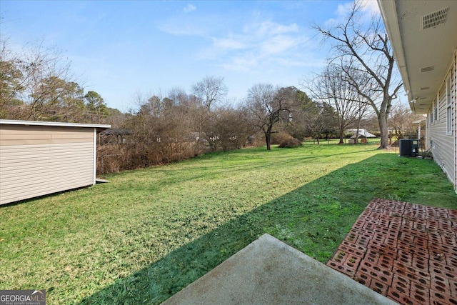 view of yard featuring central AC