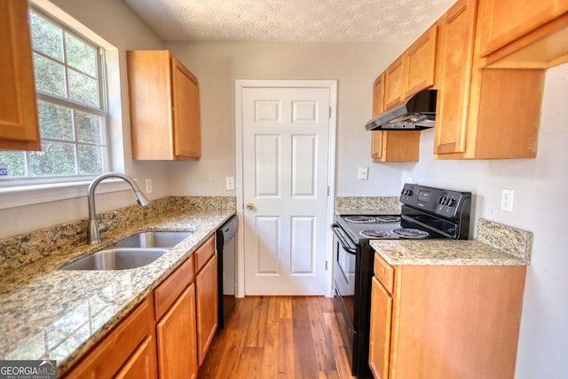 kitchen with sink, exhaust hood, a textured ceiling, dark hardwood / wood-style floors, and black appliances