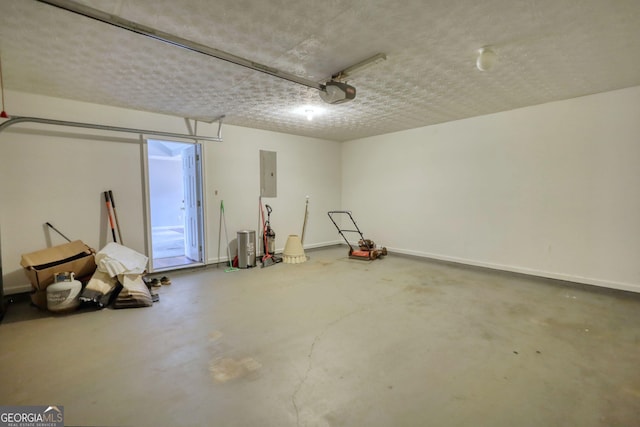 garage featuring a garage door opener and electric panel