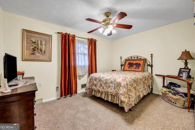 bedroom featuring ceiling fan and light carpet