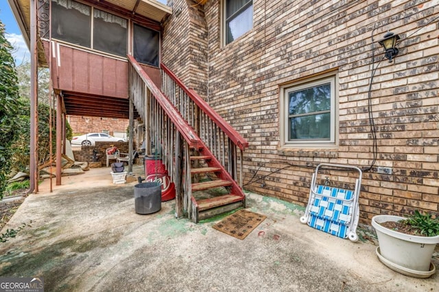 doorway to property featuring a patio