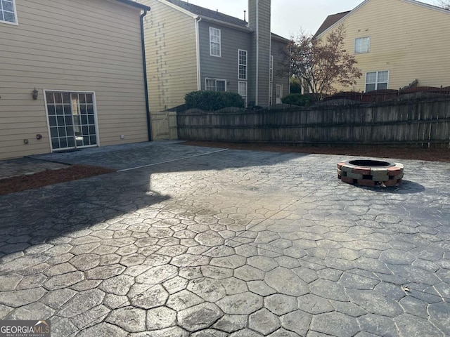 view of patio with an outdoor fire pit