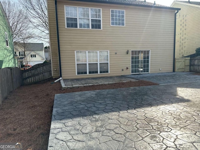 rear view of house with a patio