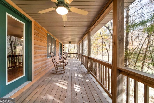 wooden deck with ceiling fan and covered porch