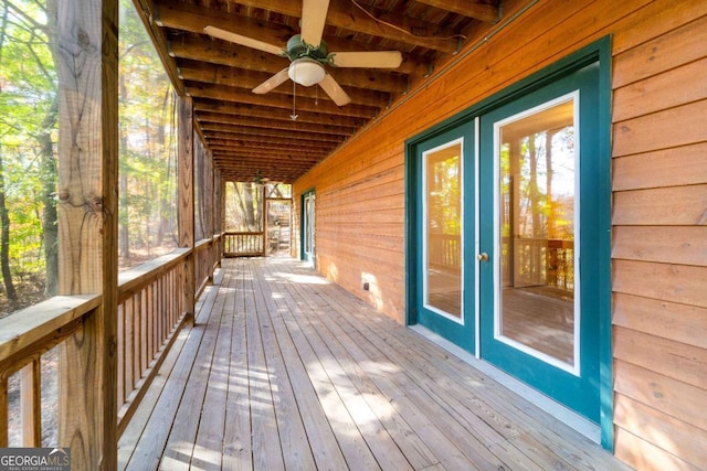 deck with ceiling fan and french doors