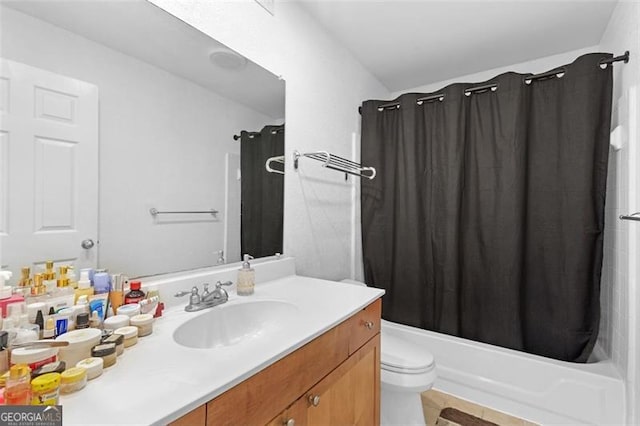 full bathroom featuring shower / tub combo with curtain, vanity, and toilet