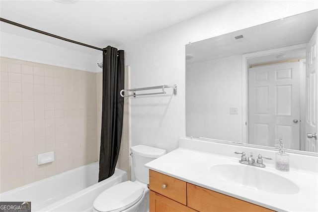 full bathroom featuring vanity, shower / tub combo, and toilet