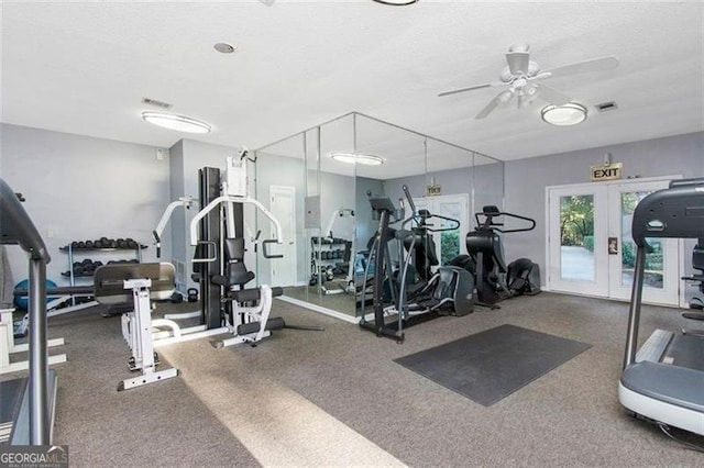 exercise room with french doors, ceiling fan, and a textured ceiling