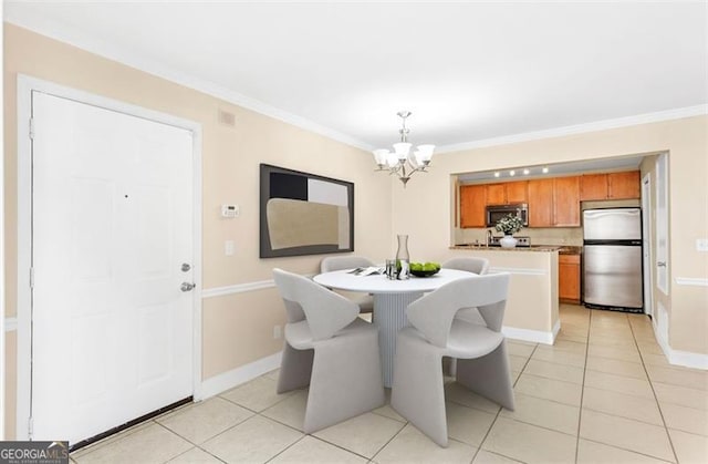 tiled dining room featuring an inviting chandelier and crown molding