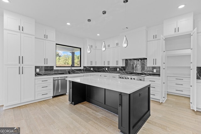 kitchen featuring dishwasher, hanging light fixtures, white cabinets, a kitchen island, and custom exhaust hood