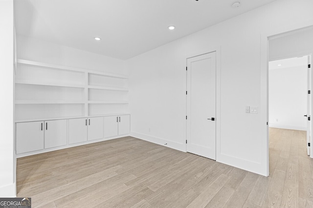 empty room with light hardwood / wood-style floors