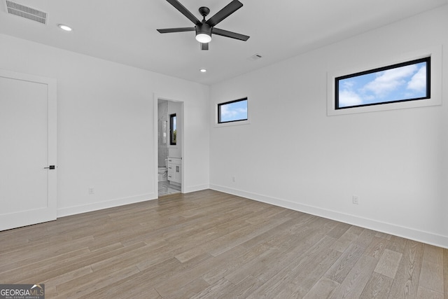 spare room with light hardwood / wood-style floors and ceiling fan