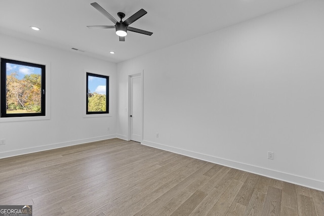 spare room featuring ceiling fan and light wood-type flooring