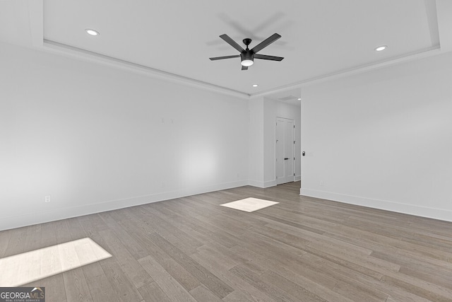 spare room featuring ceiling fan and light hardwood / wood-style floors