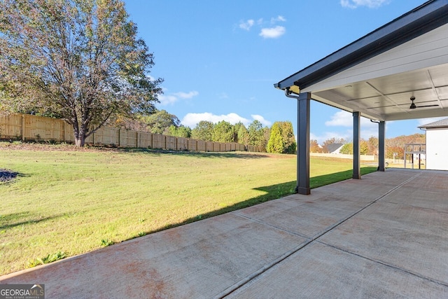 view of yard featuring a patio and ceiling fan